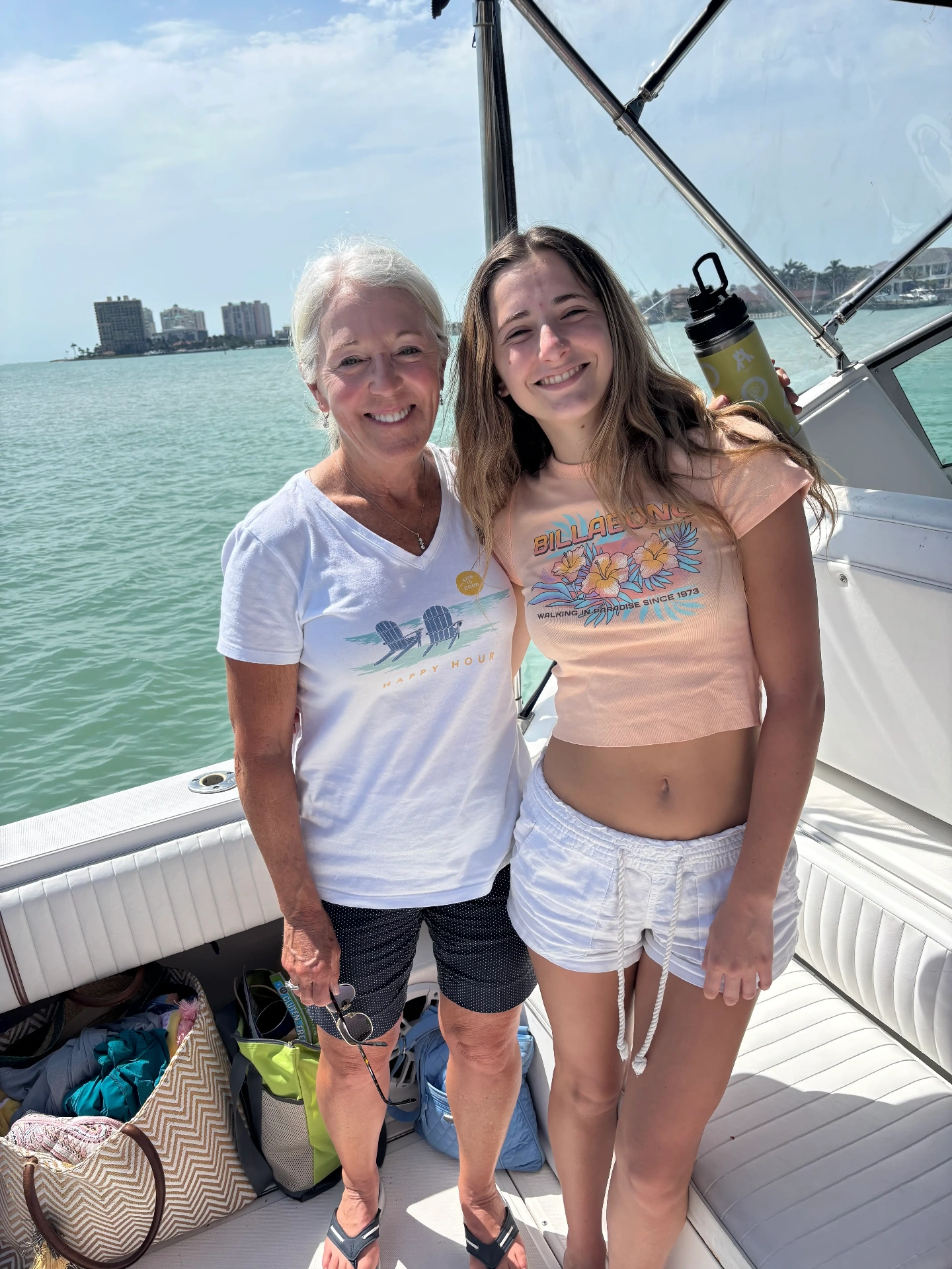Grandmother and granddaughter on boat