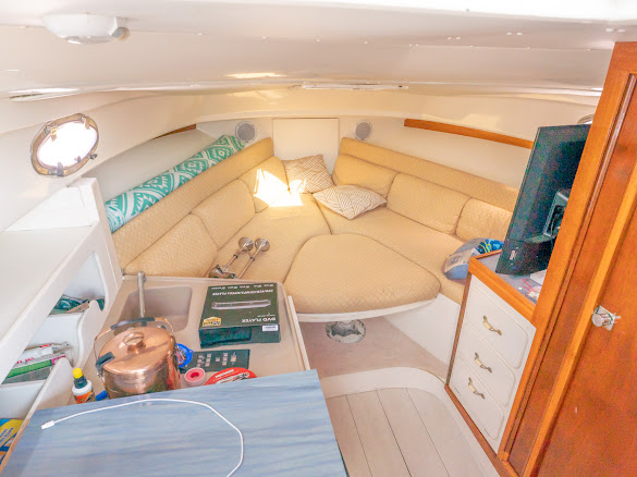 Sweet Melissa interior cabin with seating, kitchen, and entertainment