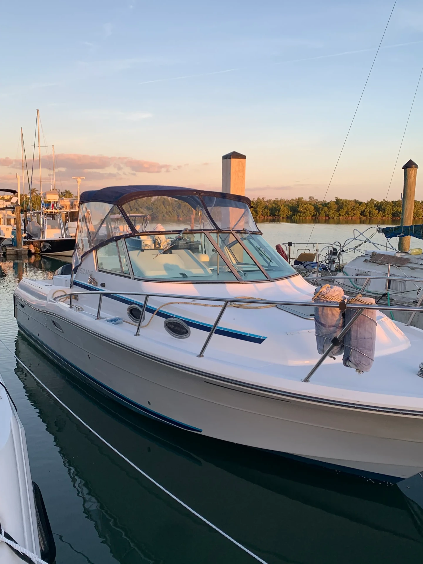 Sweet Melissa yacht docked at the marina during golden hour