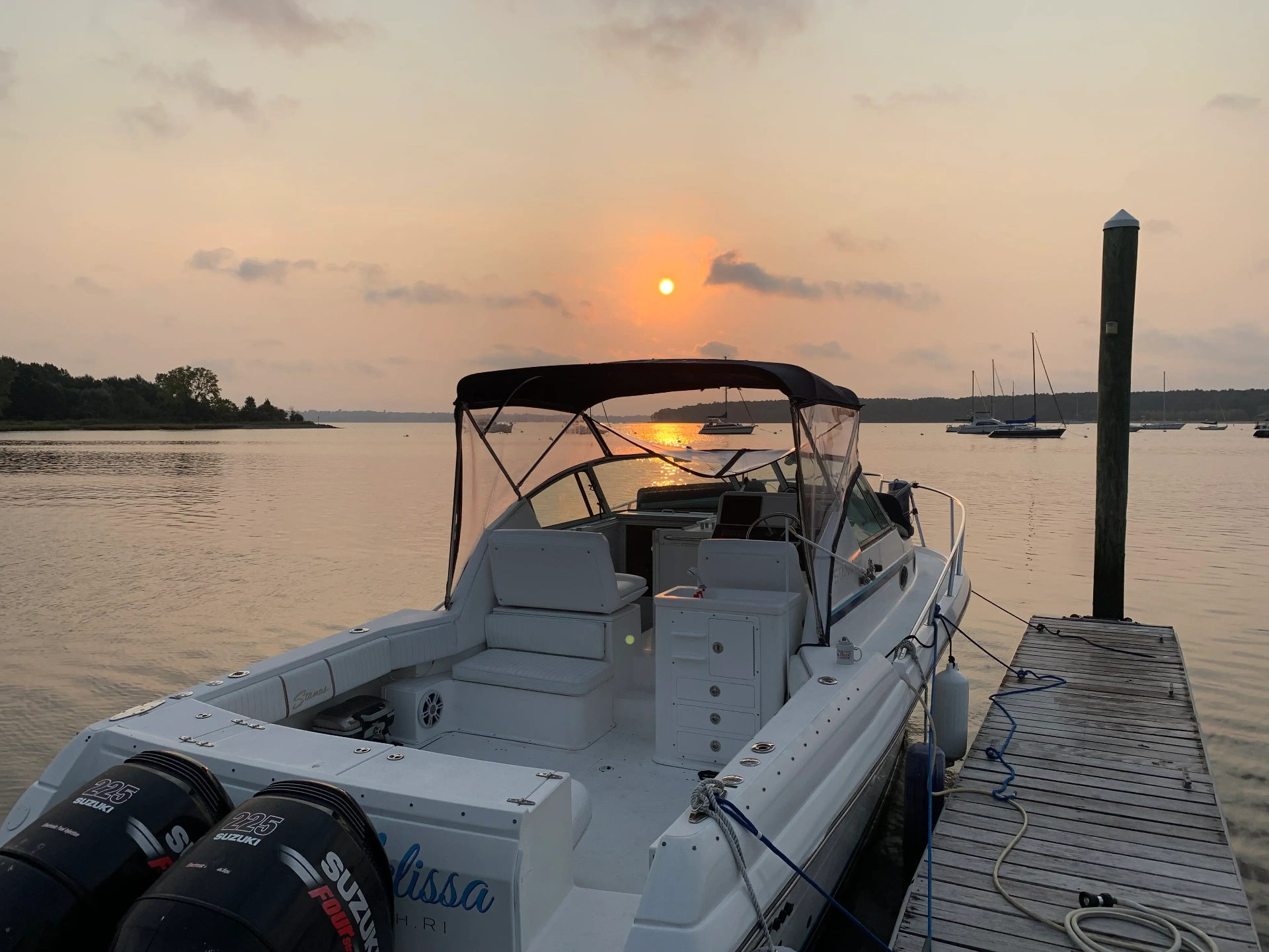 Sweet Melissa yacht at sunset docked at the marina