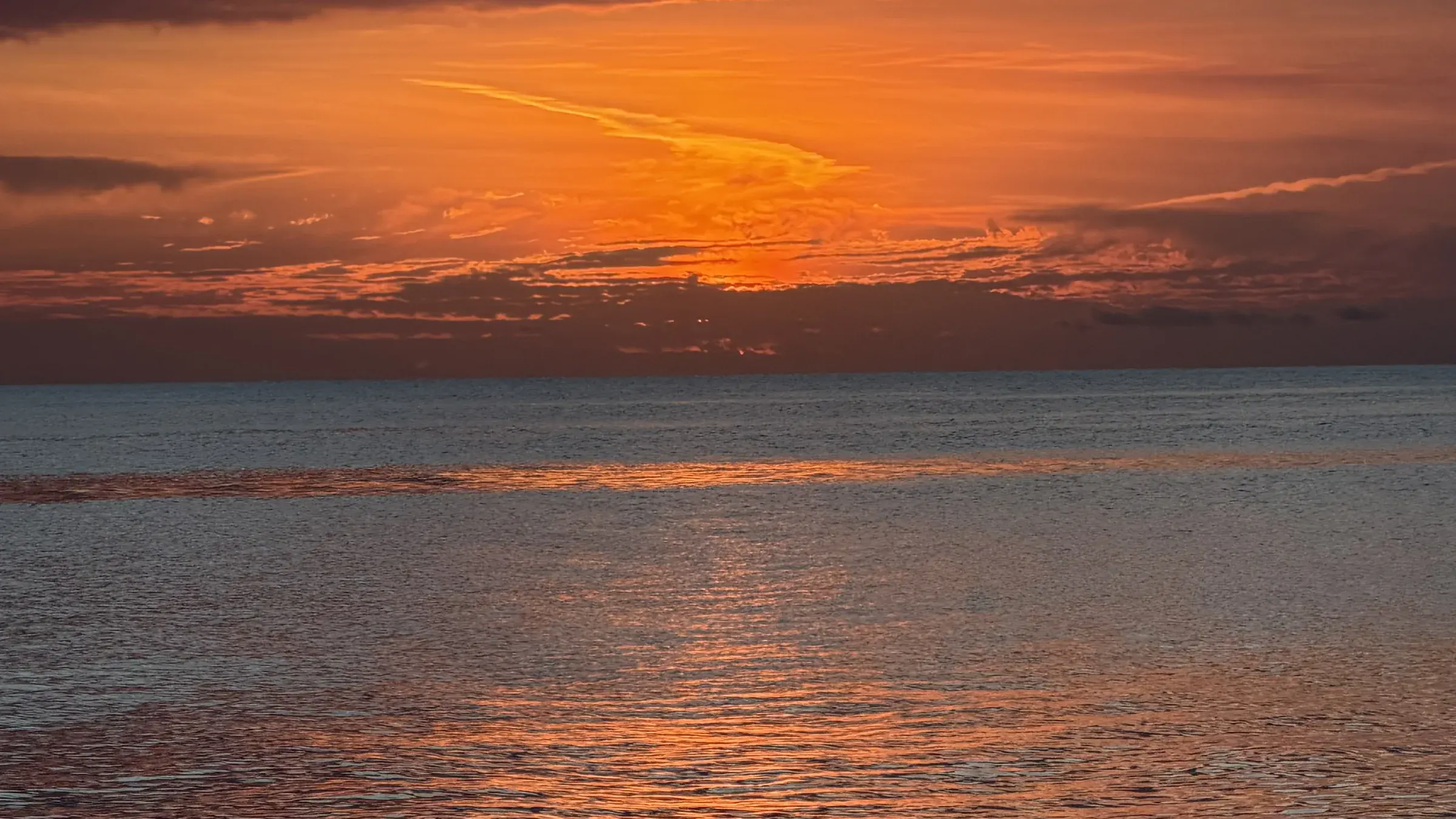 The last of the light spreading across open water off Marco Island